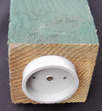 photo of bed raiser biscuit attached to rough hewn timber leg